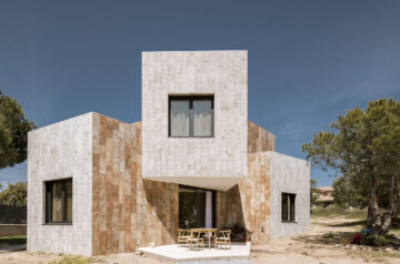 OOIIO Architecture Plays With Intersection Of Red Ceramic-Tiled Volumes To Create House In Madrid