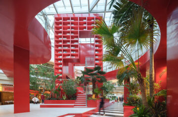 CLOU Architects Adds Bright Reddish Cube To Atrium To Evoke Henri Rousseau’s Mysterious Paintings