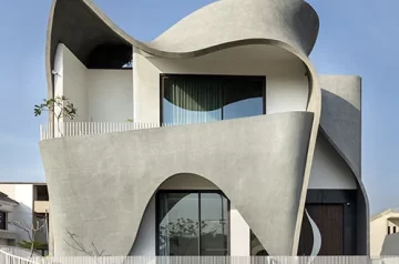 Concrete ribbon wraps around studio ardete’s residence in india