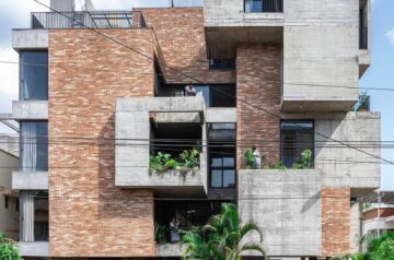 Concrete and brick interplay on multi-layered residence’s geometric facade by rahul pudale